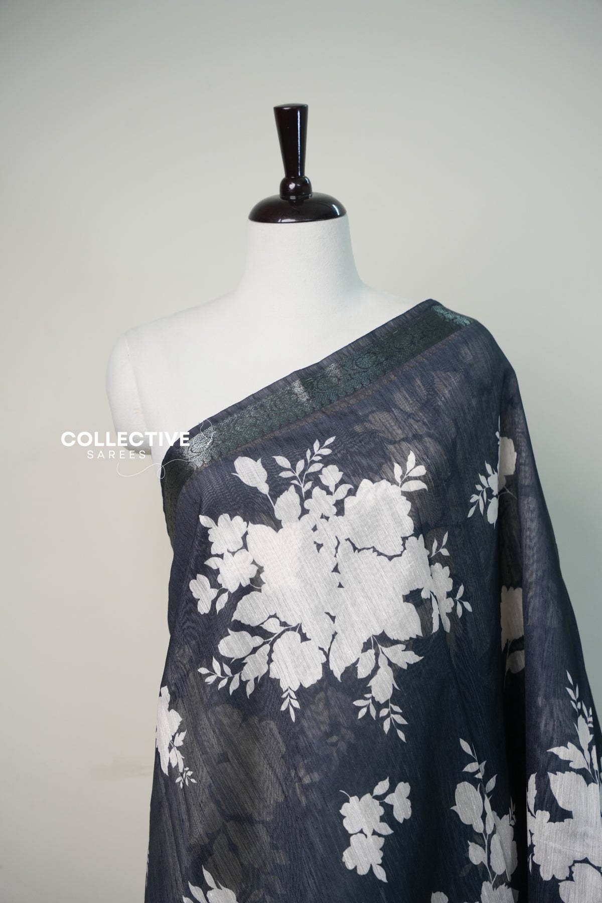 Black chanderi saree white floral print close-up with zari border