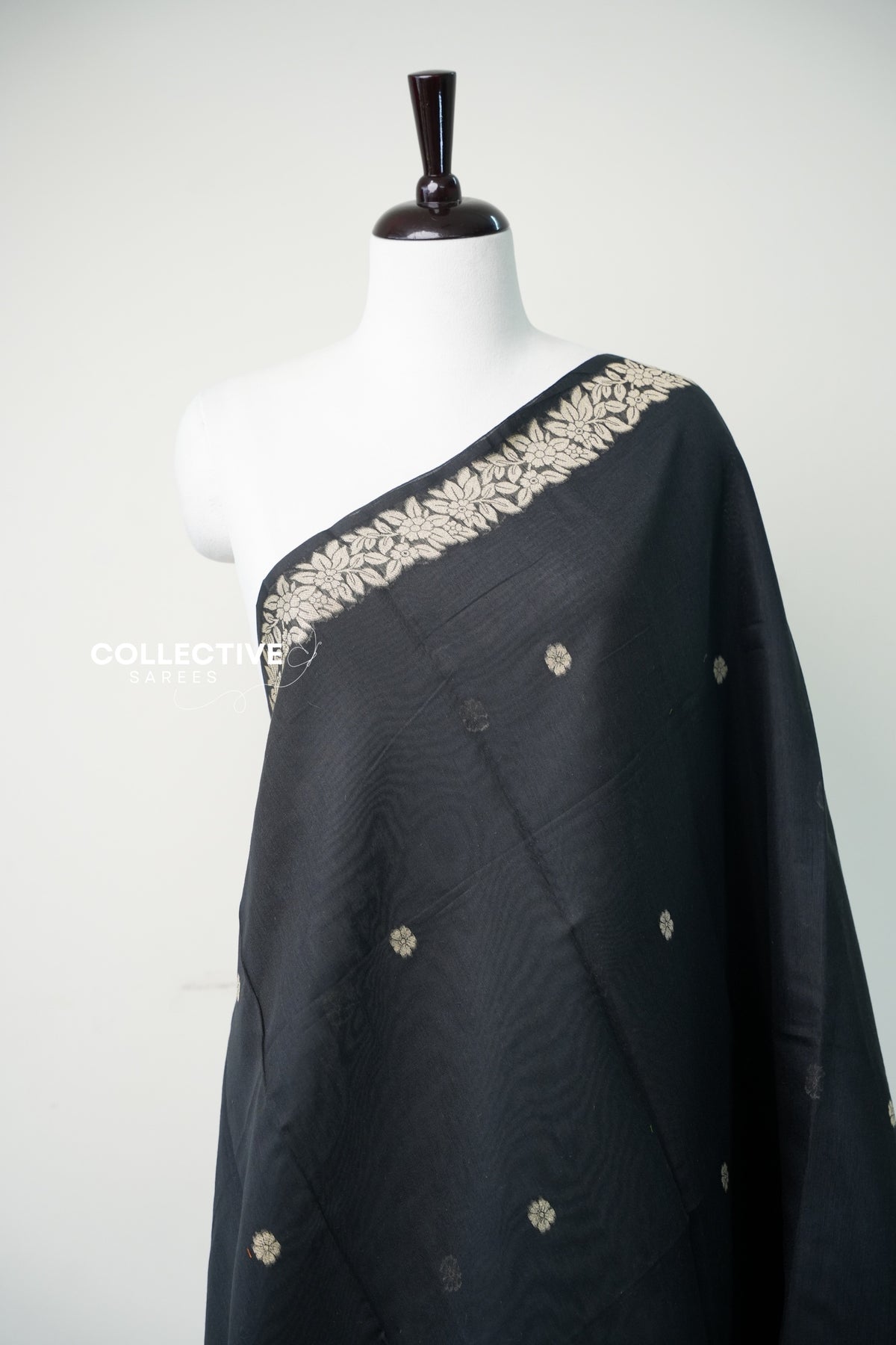 Black chanderi cotton saree floral vine border and buttis close-up