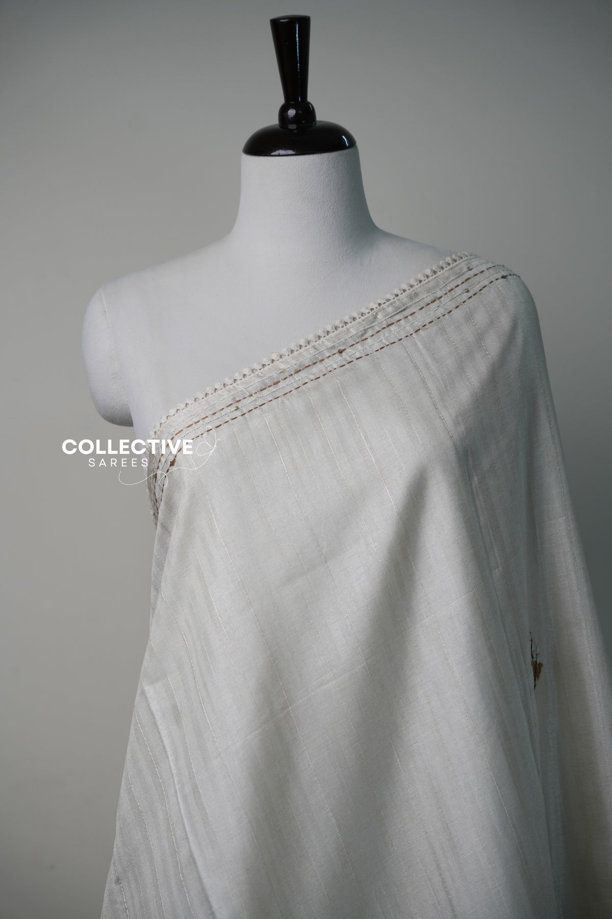 Beige dupion saree self-stripe fabric and running-stitch lace border