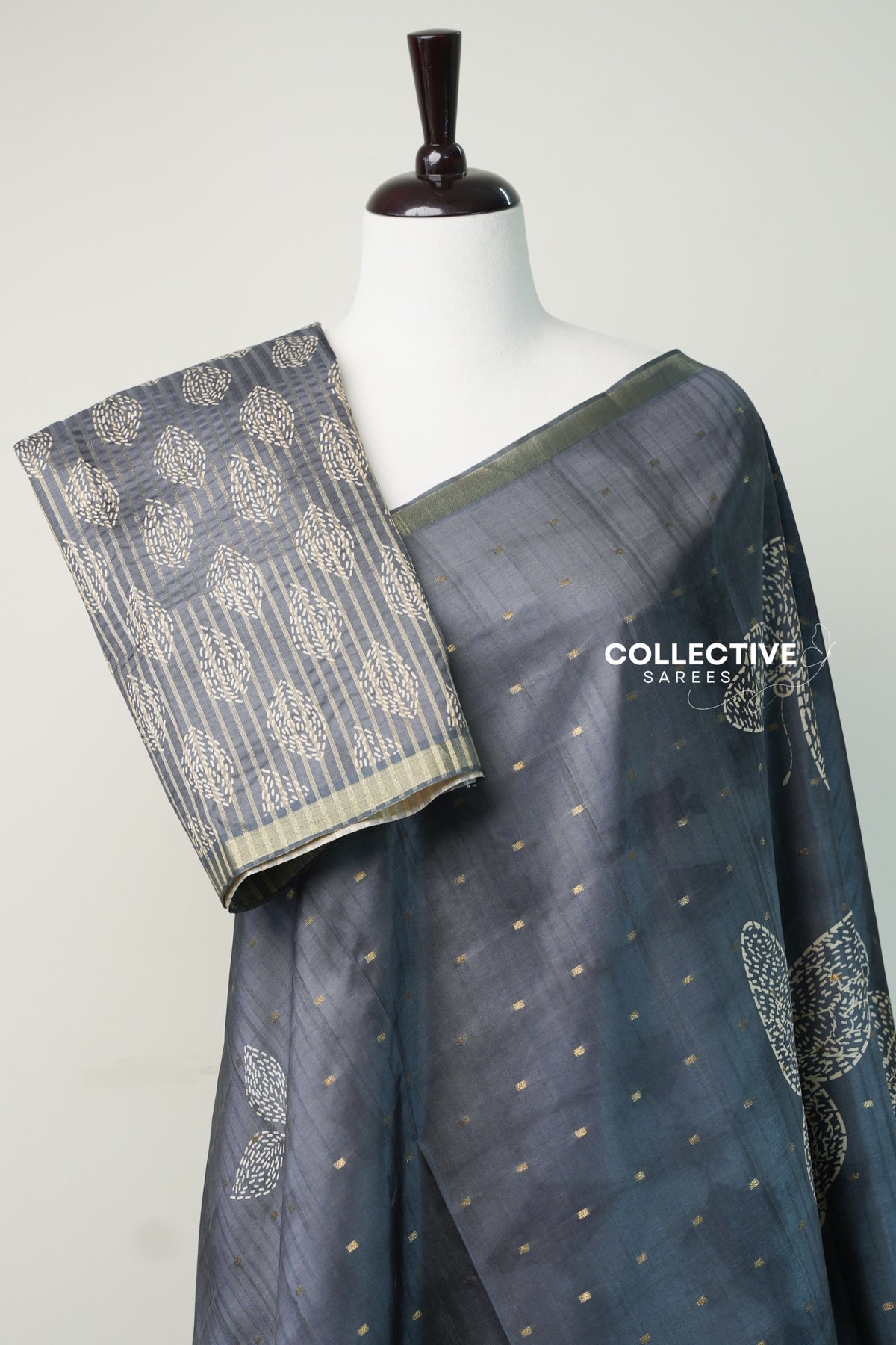 Grey dupion silk saree with striped blouse piece and ivory motifs