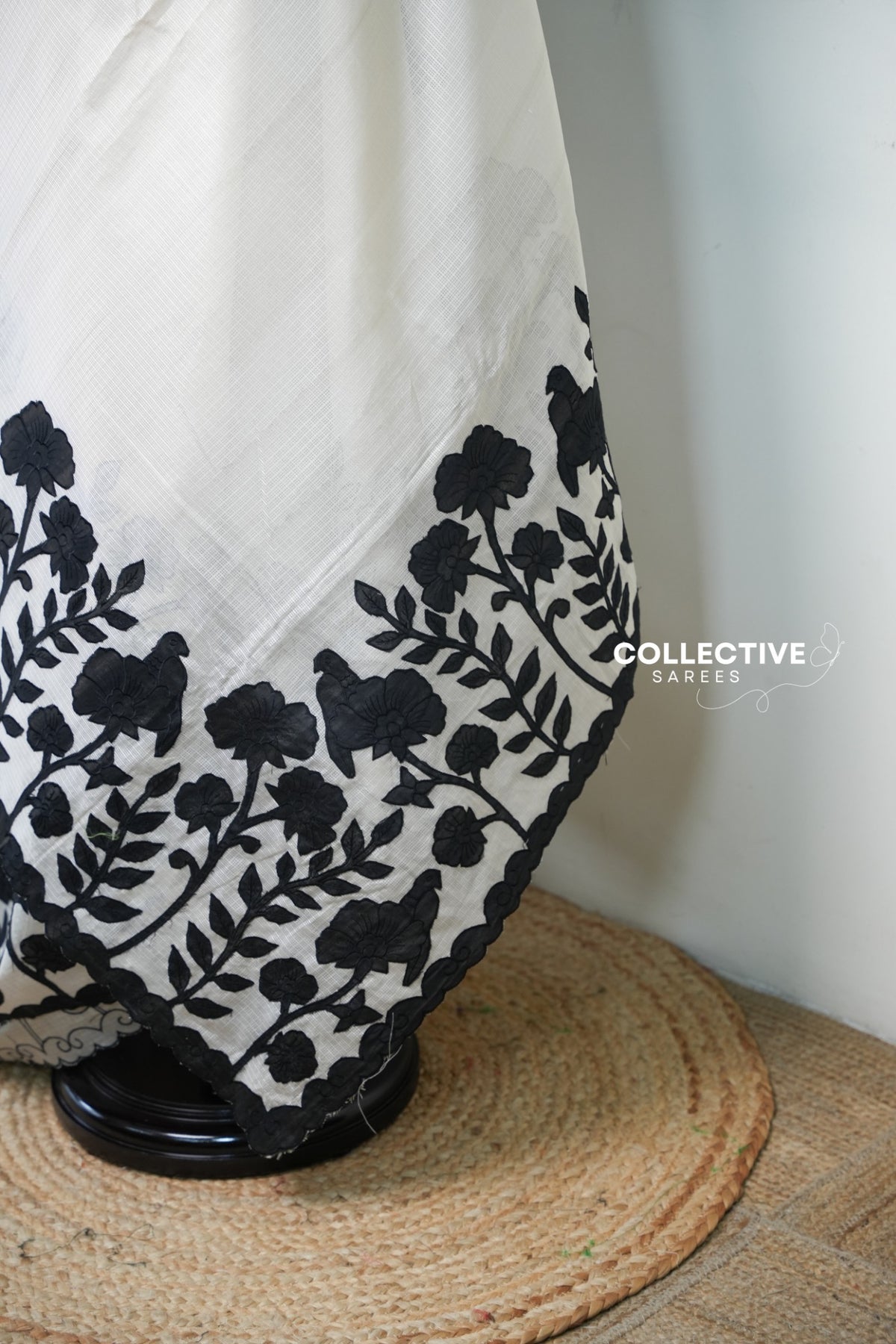 Kota off-white saree with black floral appliqué work — appliqué border detail