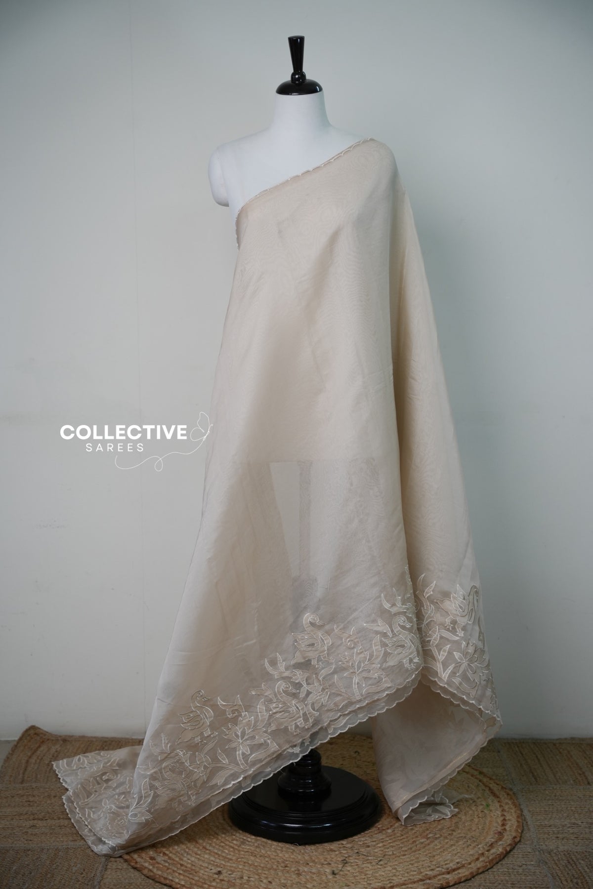 Beige organza saree with floral and bird border