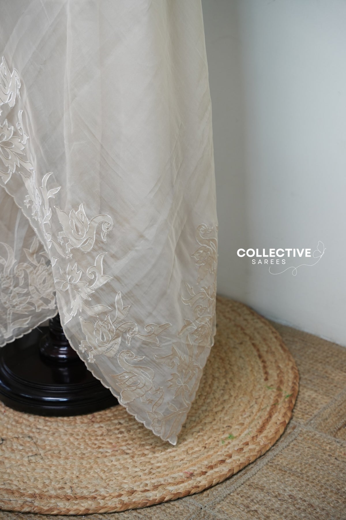 Beige organza saree with floral and bird border