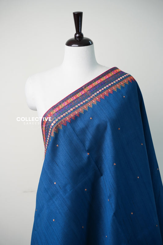 Teal blue semi jute saree embroidered temple border and buttis close-up