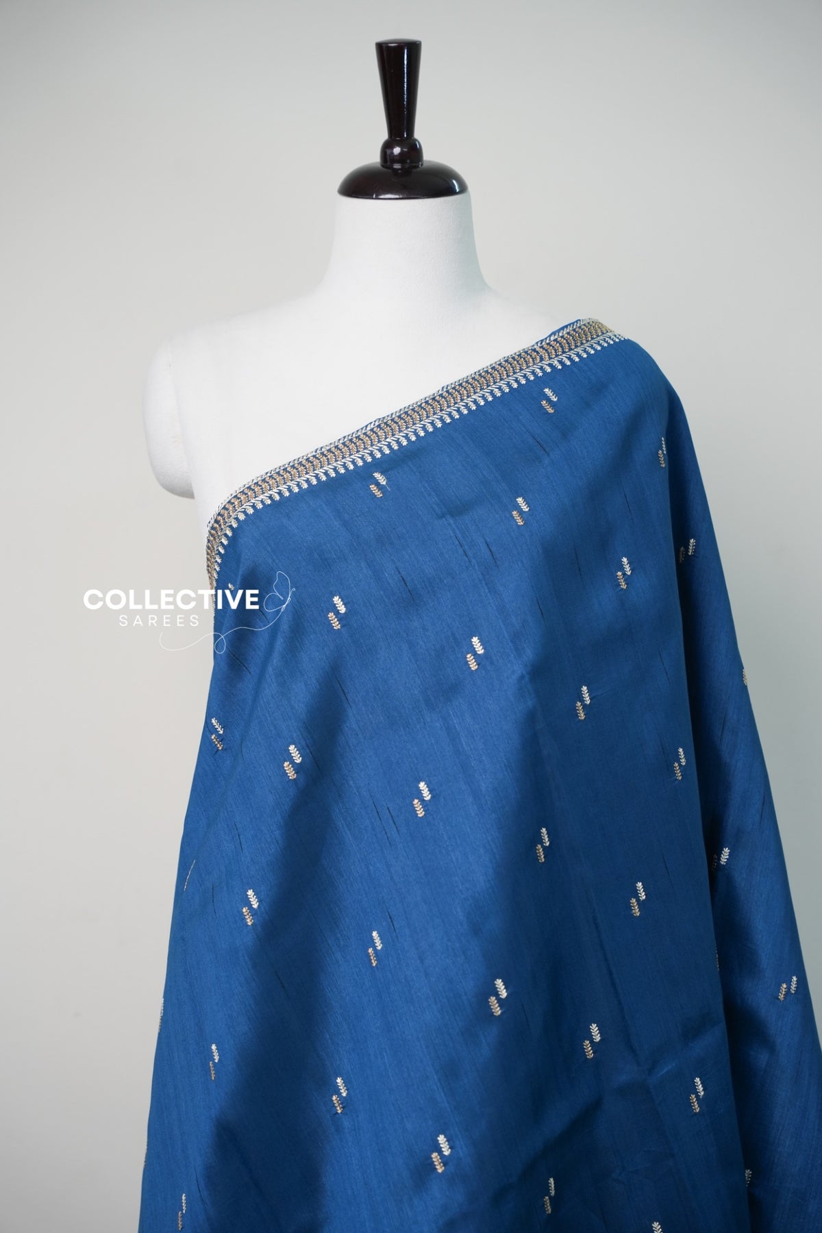 Blue saree with gold-toned and ivory leaf motifs — view 3