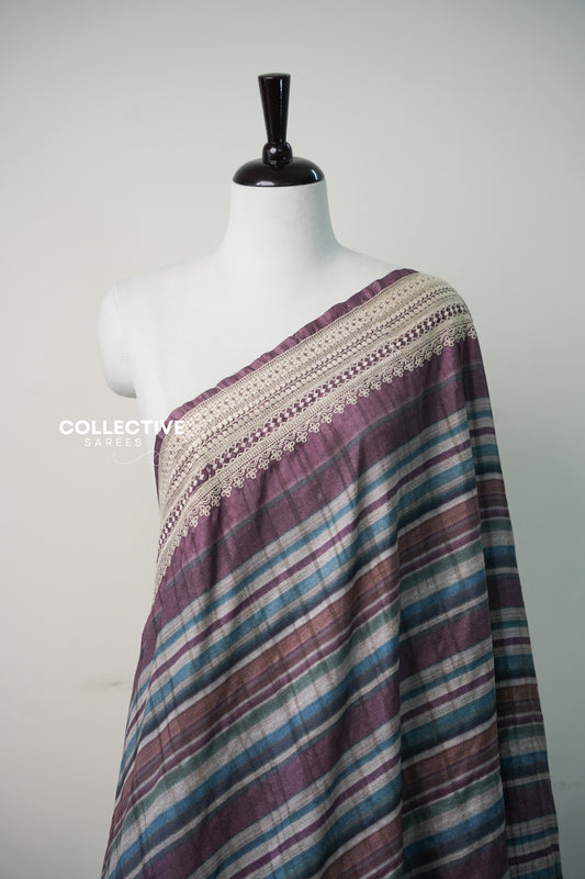 Plum semi tussar saree striped body and ivory lace-edged border close-up