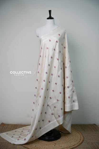 Off-white semi tussar saree with rose-pink floral embroidery, full drape