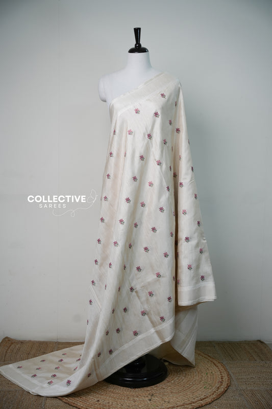 Off-white semi tussar saree with rose-pink floral embroidery, full drape