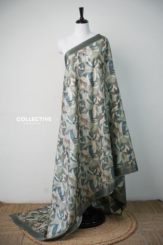 Earthy green dupion saree with multicolour leaf print and sage zari border, full drape