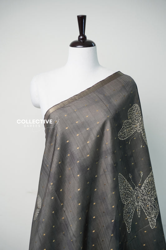 Teal green dupion silk saree with gold zari buttis and butterfly motif close-up