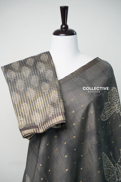 Teal green dupion silk saree pleats with striped blouse piece and ivory motifs