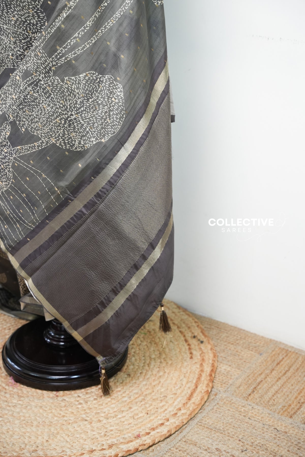 Teal green dupion silk saree striped zari pallu with lotus motif and tassels