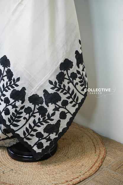 Kota off-white saree with black floral appliqué work — appliqué border detail