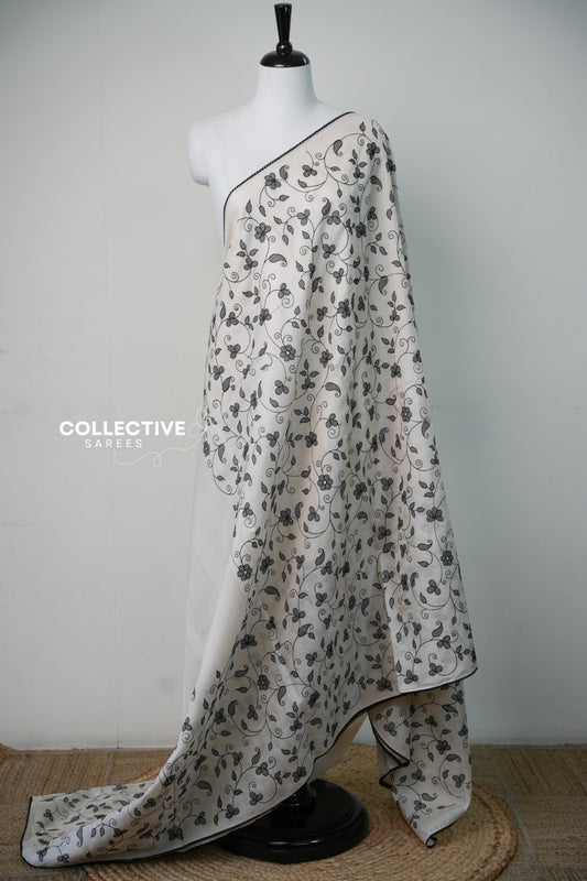 Off-white and black Kota Doria saree with floral and vine motifs — view 1