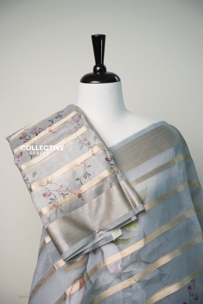 Ash organza saree with floral print blouse piece and tissue border