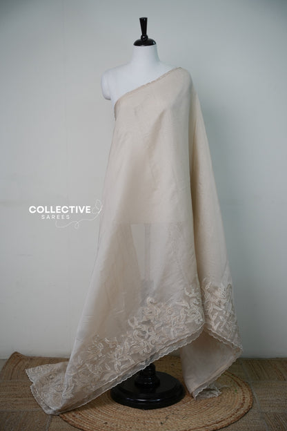 Beige organza saree with floral and bird border