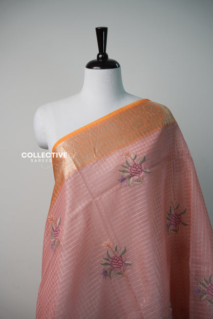 Salmon peach organza saree with silver checks and rose embroidery close-up