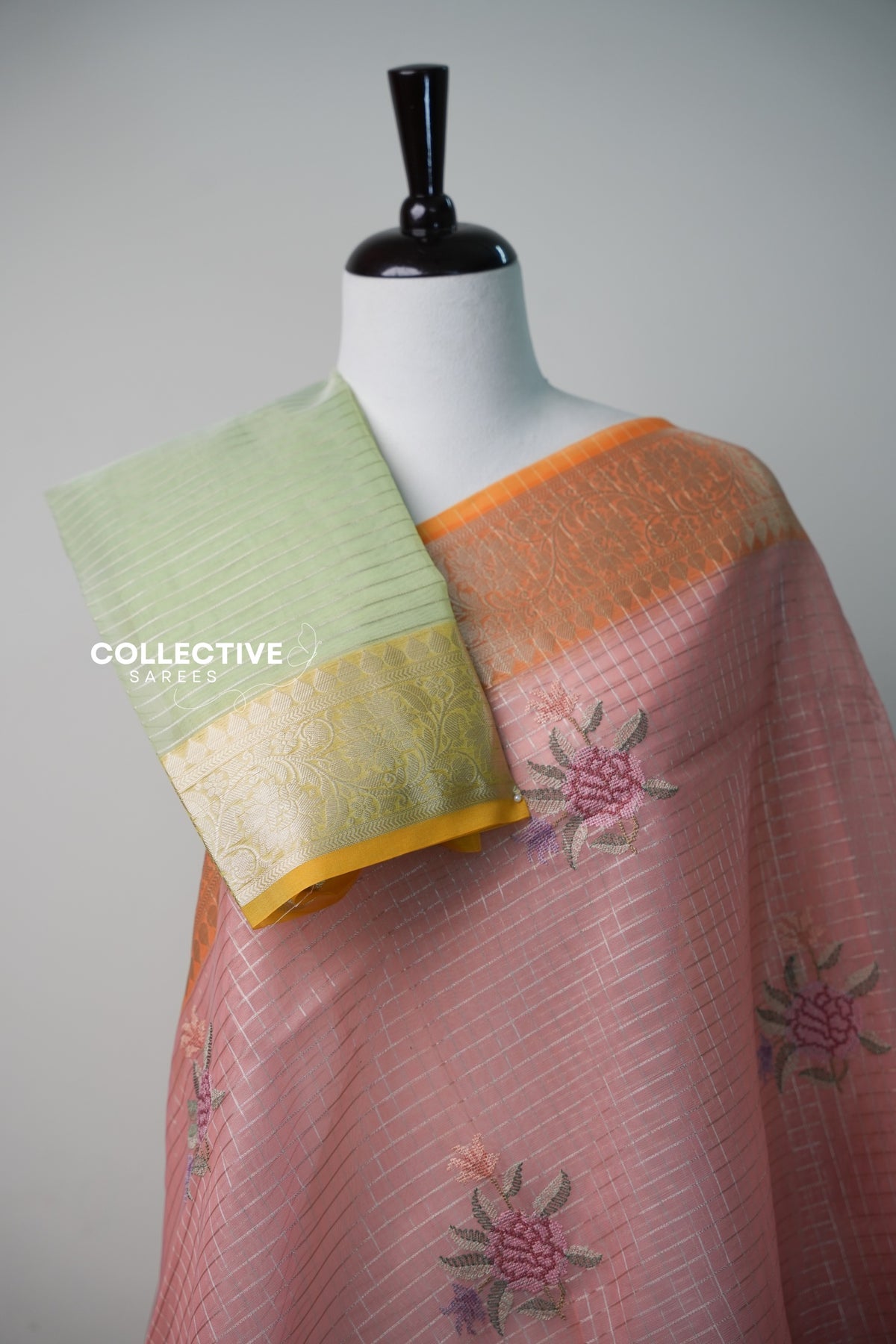 Salmon peach organza saree with pistachio green blouse piece and yellow zari border