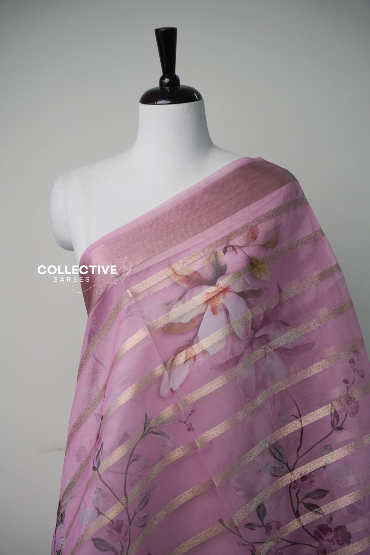 Pink organza saree watercolour magnolia and zari stripe close-up