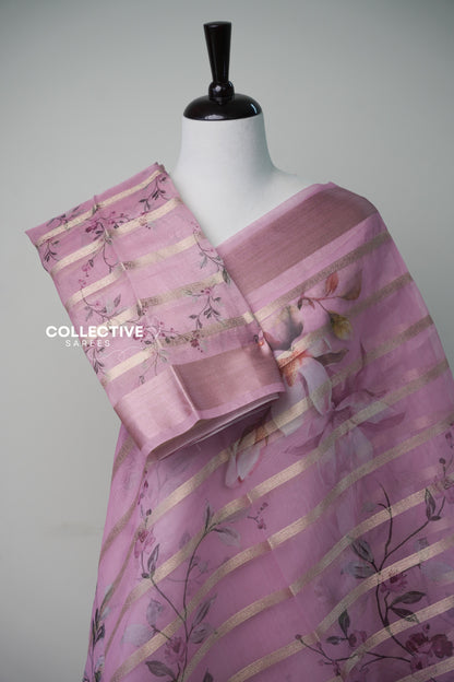 Pink organza saree with floral print blouse piece and rose-gold border