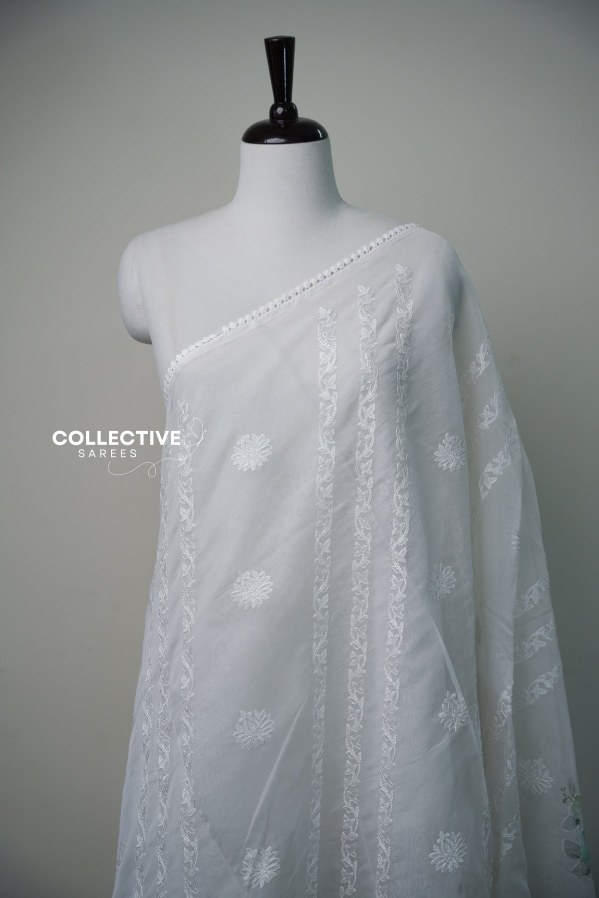 White organza saree with floral detailing and pastel floral pallu — view 1