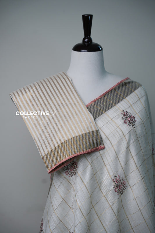 Cream soft tissue saree with gold-toned checks and pink floral motifs — view 2