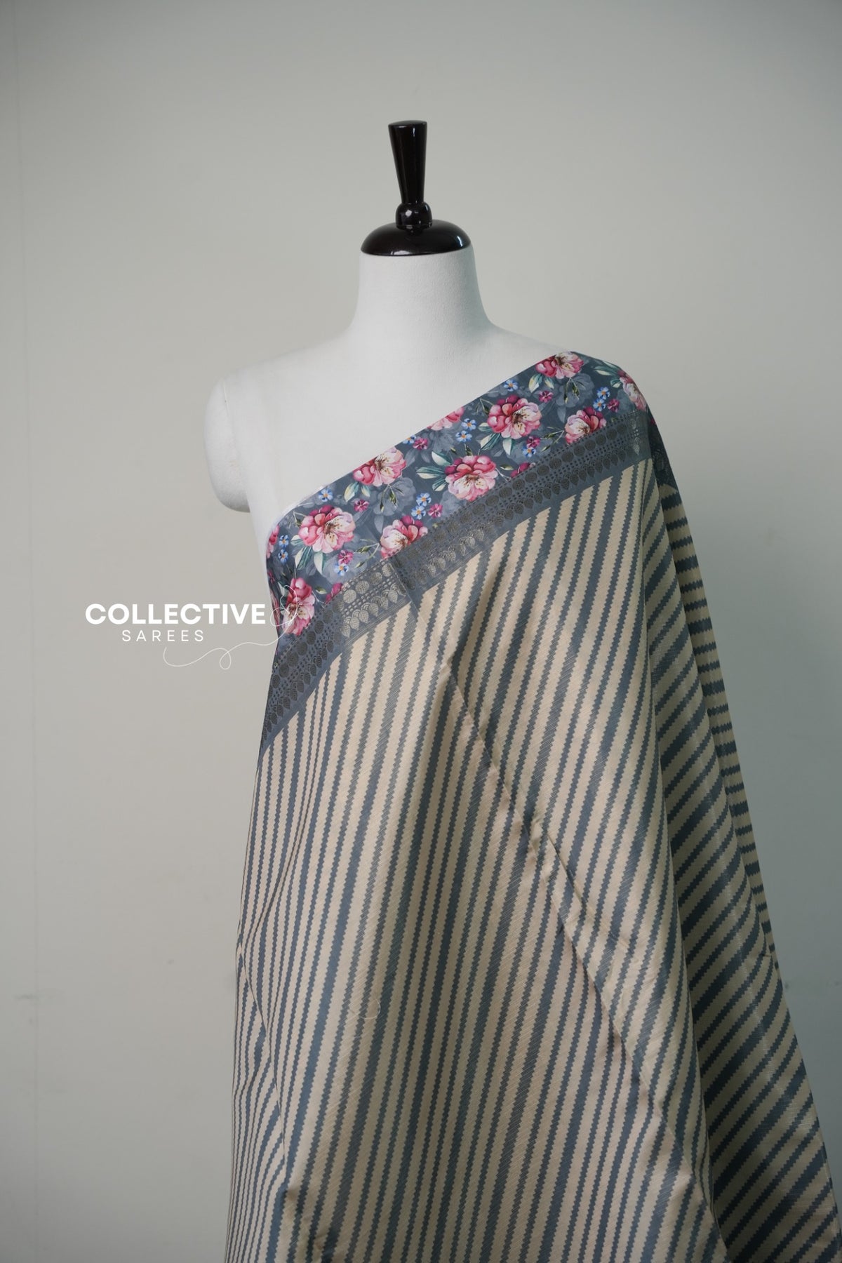 Dark ash saree striped body and floral border detail