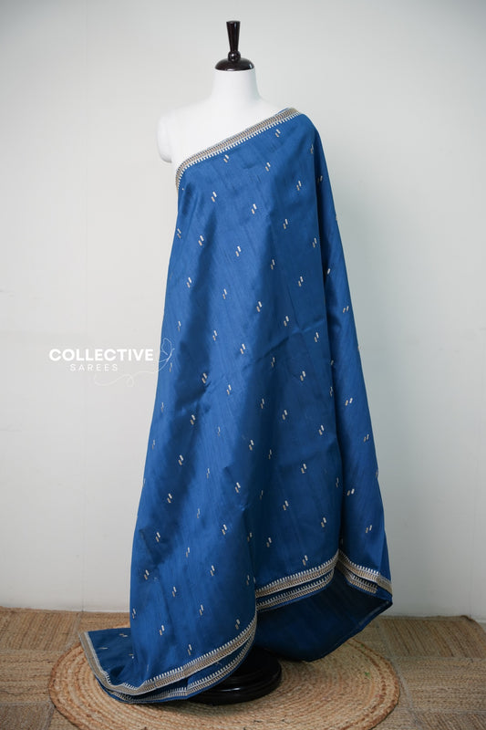 Blue saree with gold-toned and ivory leaf motifs — view 1
