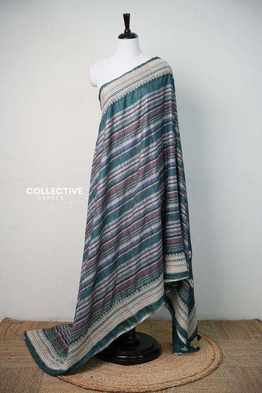 Teal green tussar saree with multicolour diagonal stripes and ivory embroidered border, full drape