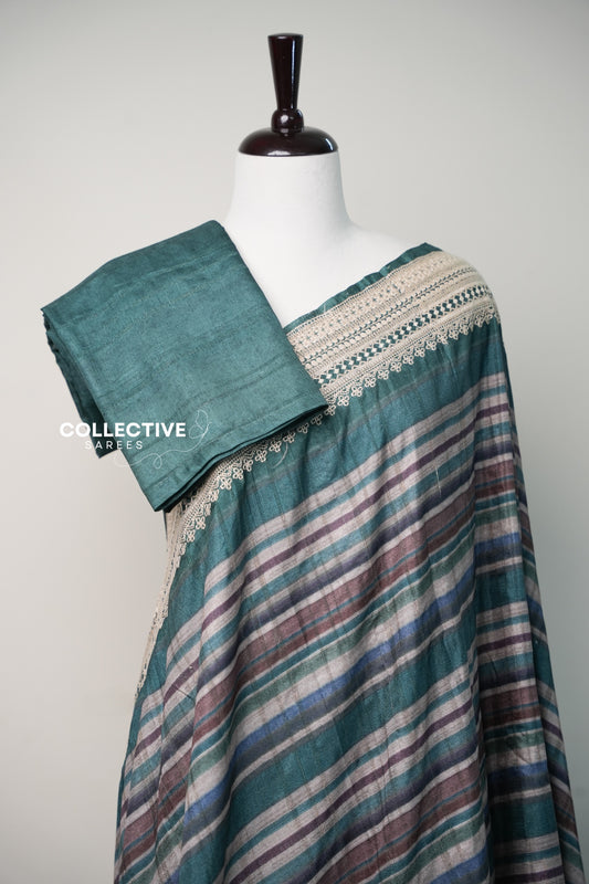 Teal green tussar saree pleats with plain teal blouse piece and embroidered border